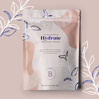 Bath salt package labeled 'Hydrate' with decorative elements on a beige background