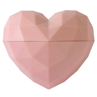 Pink heart-shaped container on a white background