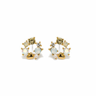 Pair of gold earrings with opal and pearl stones on a white background