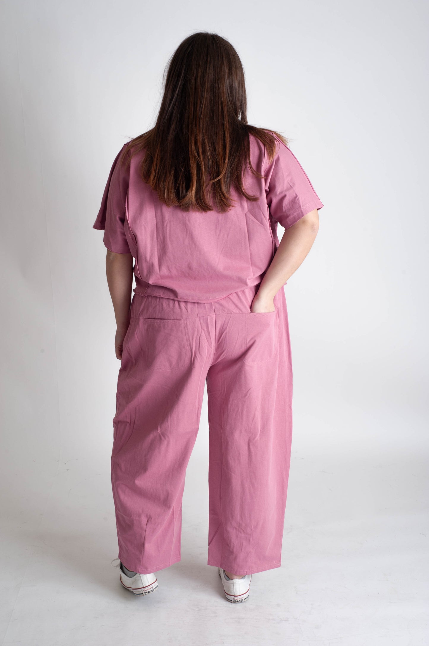 women wearing a matching pink track suit