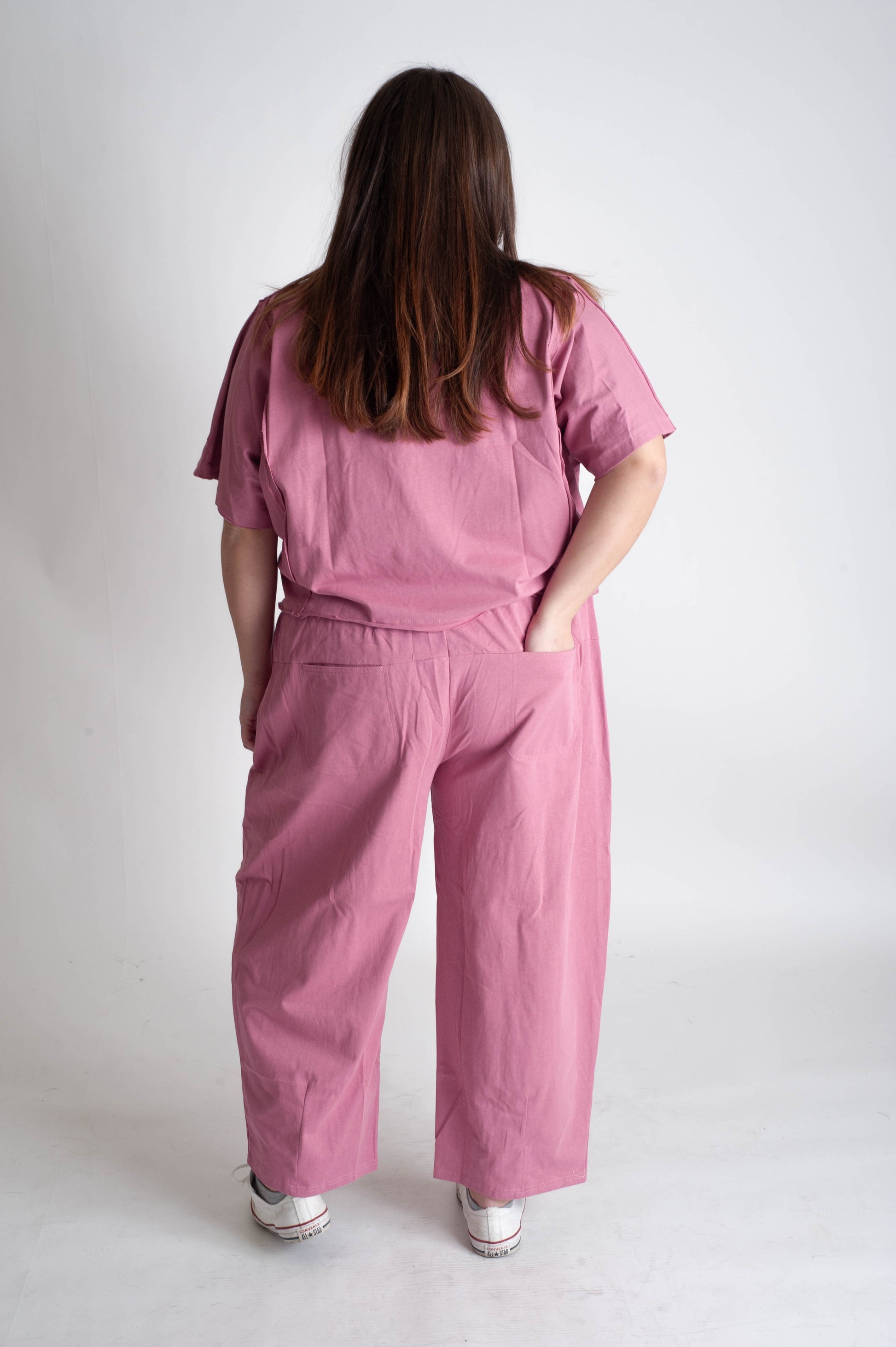 women wearing a matching pink track suit