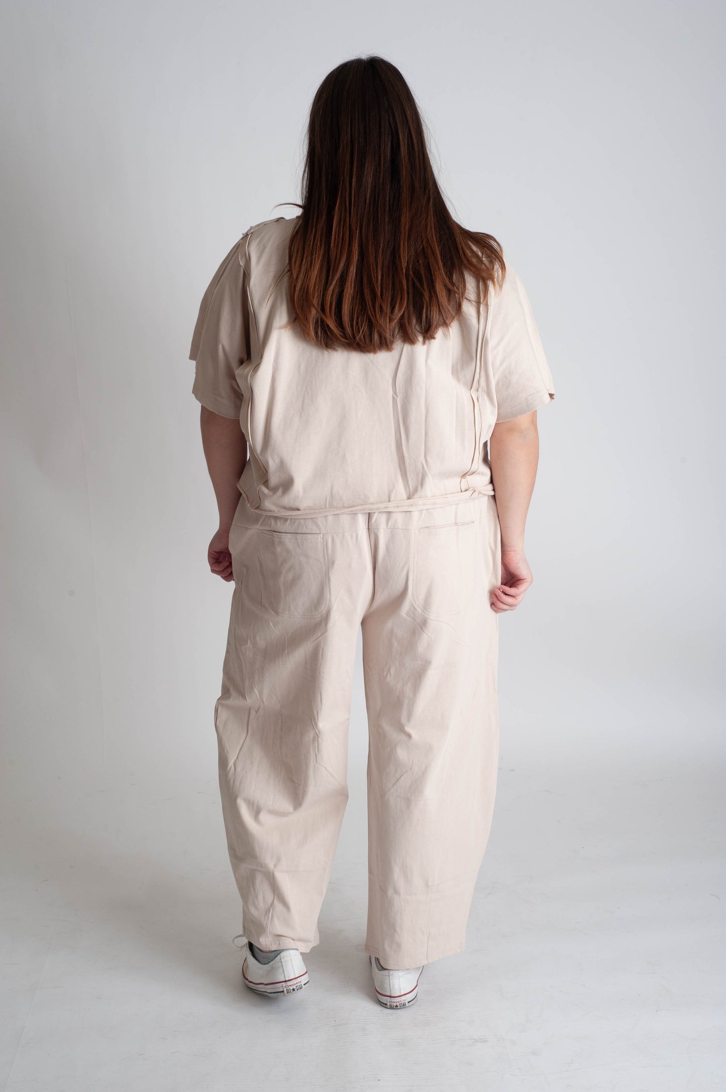 women wearing a matching beige tracksuit