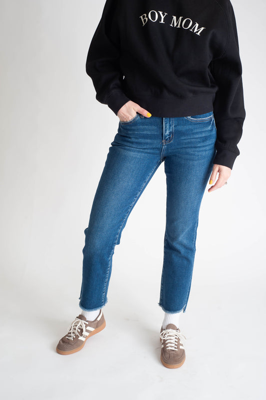 Women wearing a dark wash straight leg jean. 