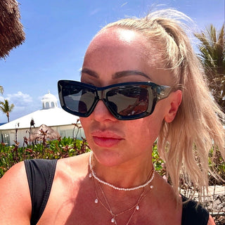women wearing black chunky sunglasses