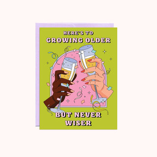 Birthday card with image of champagne celebration that reads "here's to growing older but never wiser"
