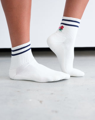women wearing white and navy floral socks