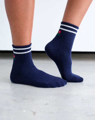 women wearing white and navy floral socks