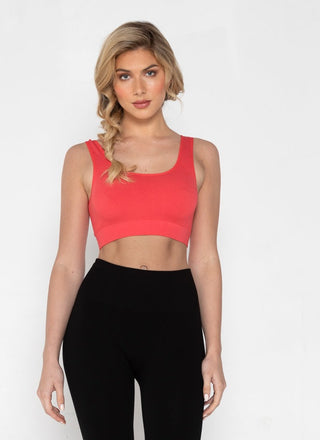 A woman wearing a bamboo bralette with leggings.