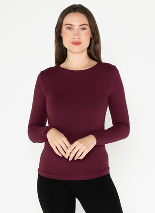 Woman wearing a burgundy crewneck top made of bamboo
