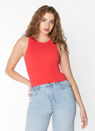 A woman wearing a red ribbed sleeveless tank top with a crew neck.
