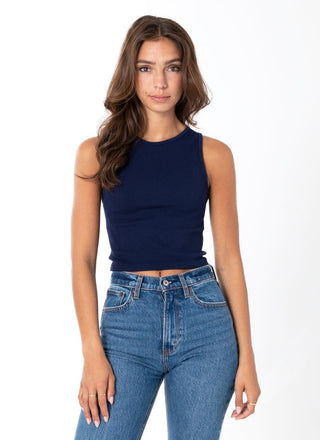 A woman wearing a Navy ribbed sleeveless tank top with a crew neck.