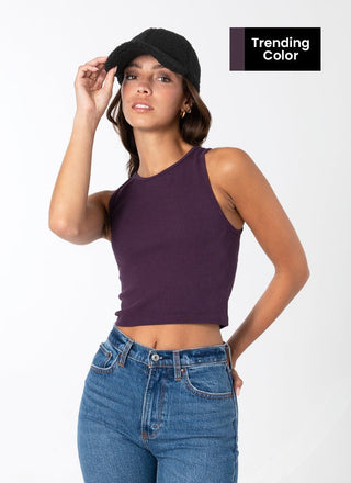 A woman wearing a purple ribbed sleeveless tank top with a crew neck.