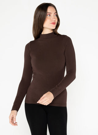 Woman wearing a brown mock neck top made of bamboo