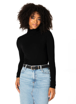 women wearing a black bamboo turtleneck