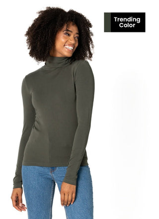 women wearing a green bamboo turtleneck