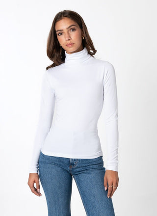 women wearing a white bamboo turtleneck