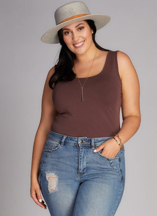 A woman wearing a Bamboo Curvy Classic Tank Top with thick straps and a scoop neckline.
