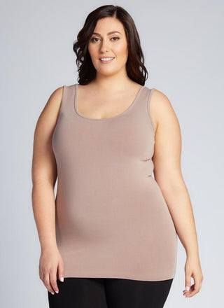 A woman wearing a Bamboo Curvy Classic Tank Top with thick straps and a scoop neckline.