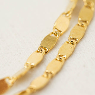 a close up on the gold details of a double layer bracelet