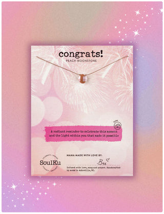 Necklace with peach moonstone on a 'Congrats!' card by SoulKu against a pink and purple gradient background.