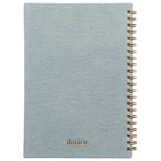 Light blue notebook with gold spiral binding on a white background