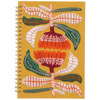 Notebook with floral embroidery on a yellow background