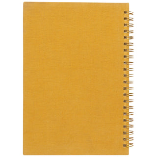 Yellow notebook with a spiral binding on a white background