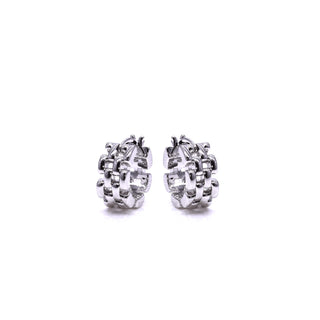 Pair of silver hoop earrings on a white background