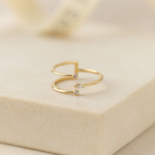 a three tiered gold ring with cz diamond