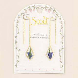 Gold earrings with natural pressed flowers on a Scout branded card.