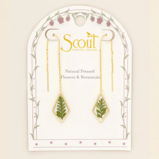Gold earrings with natural pressed flowers on a Scout branded card.