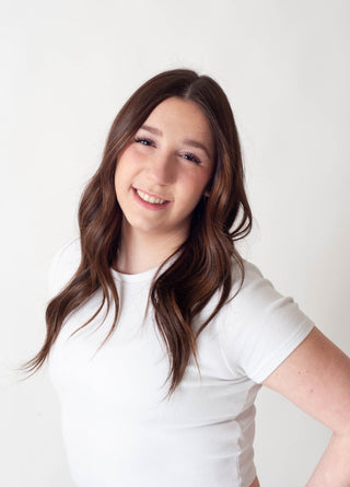 Women's headshot against a white background.