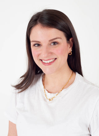 womens headshot against a white background.