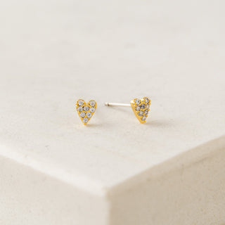 A pair of gold-plated stud earrings with cubic zirconia stones, displayed on a white surface.