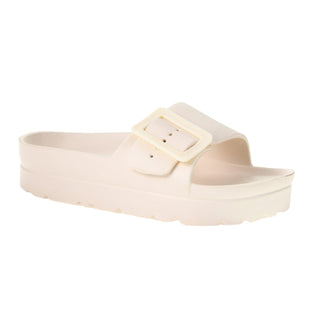 Beige sandal with a buckle on a white background