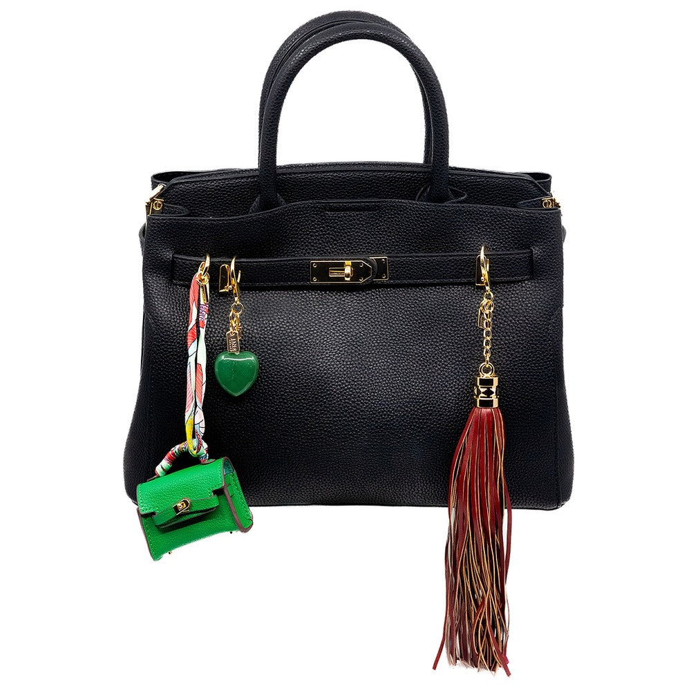 Black handbag with decorative charms on a white background