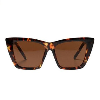 a pair of square shaped sunglasses in a tortoise colour