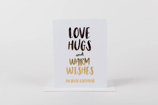 Card with 'Love hugs and warm wishes on your birthday' text on a white background
