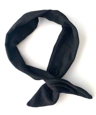 A black textured muslin scarf tied in a loose knot, displayed on a clean white background.