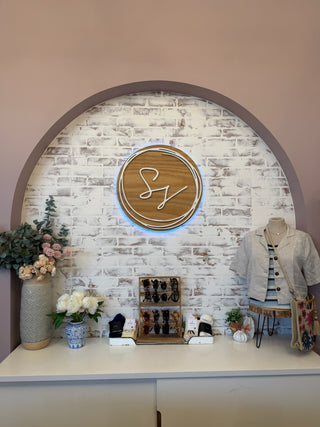 a table display at Stitch & Stone with the monogram logo