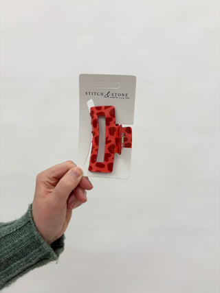 a red heart hair clip