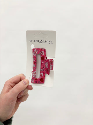 a red heart hair clip