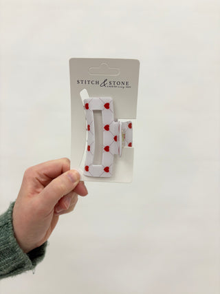 a red heart hair clip