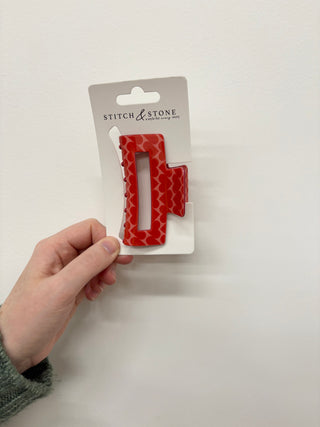 a red heart hair clip