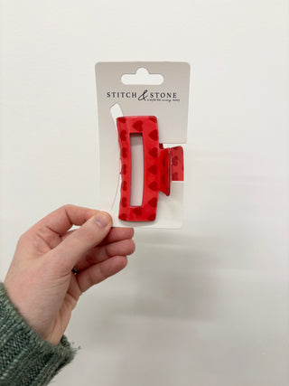 a red heart hair clip