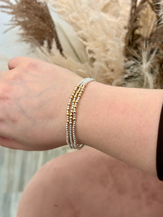 three beaded bracelets
