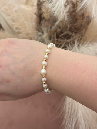 women wearing a pearl beaded bracelet