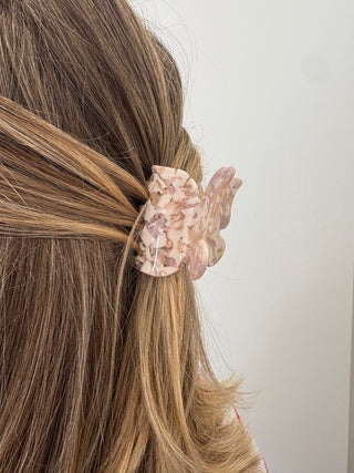 women wearing a butterfly hair clip