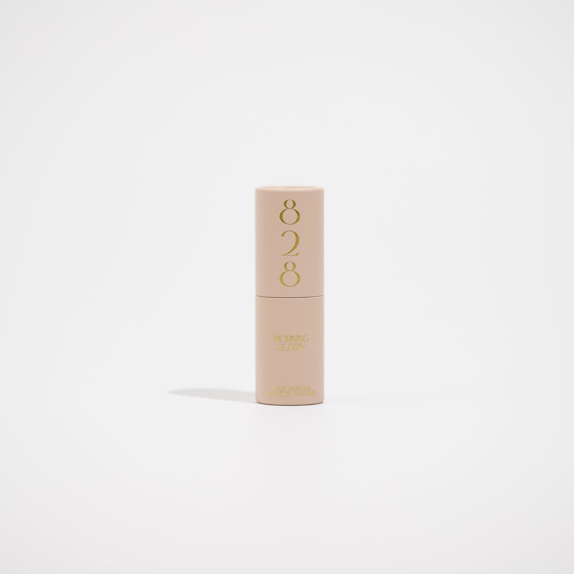 Beige perfume with '828' branding on a light beige background
