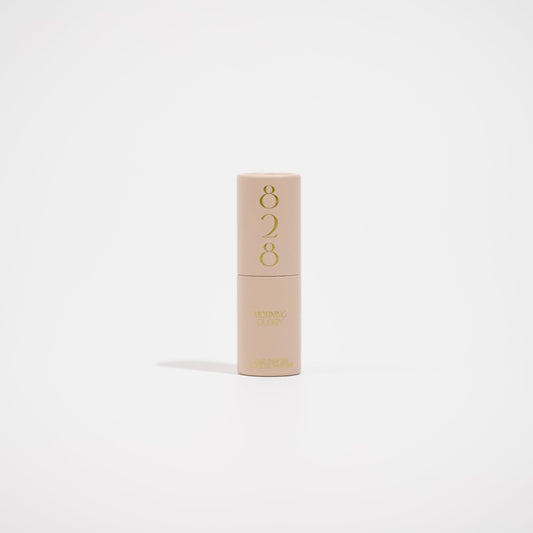 Beige perfume with '828' branding on a light beige background